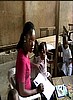 Teacher looks on